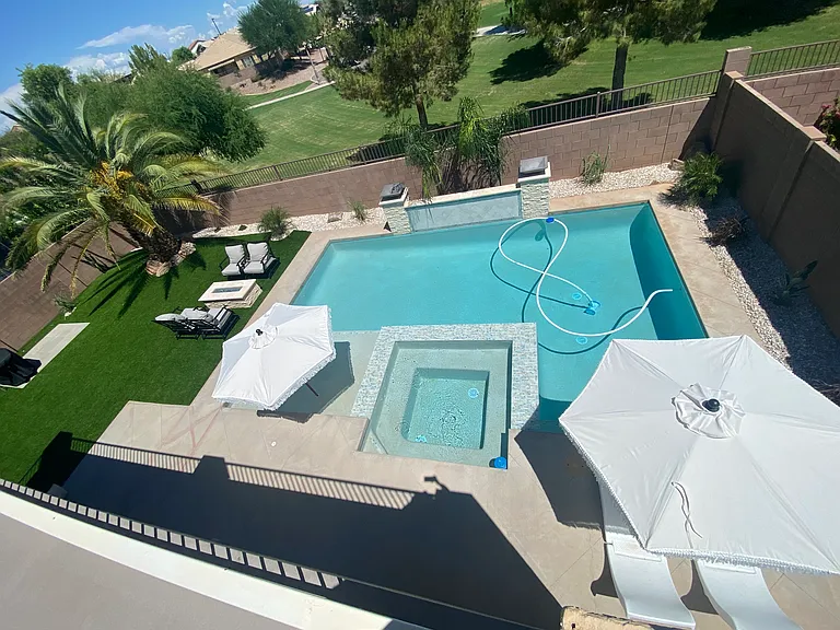 Backyard - turf and heated pool + spa