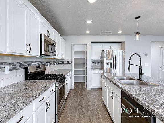 Kitchen looking in to pantry