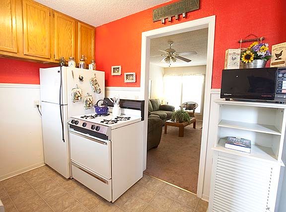 kitchen complete with double sink, garbage disposal, fridge,