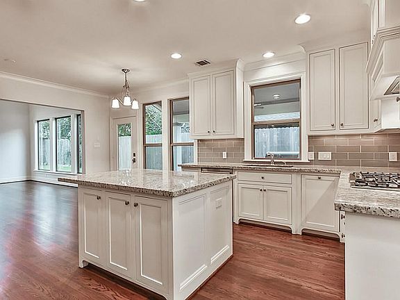 Light and bright kitchen with high end appliances, double oven, and large island perfect for entertaining.