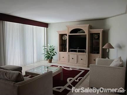 Great Room (left) : Spacious living area (only a portion shown here) connects to dining area.
