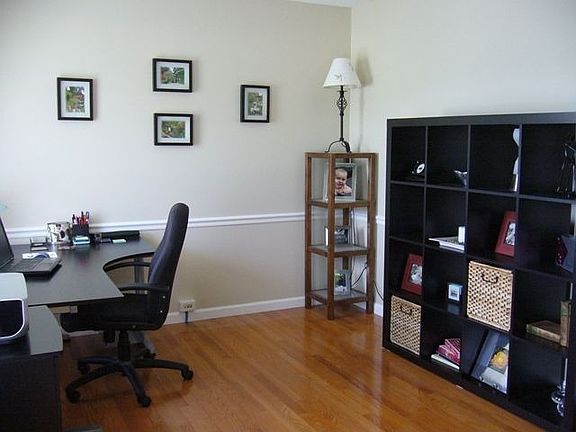 Formal Living Room with sparkling hardwood floors and chair rail