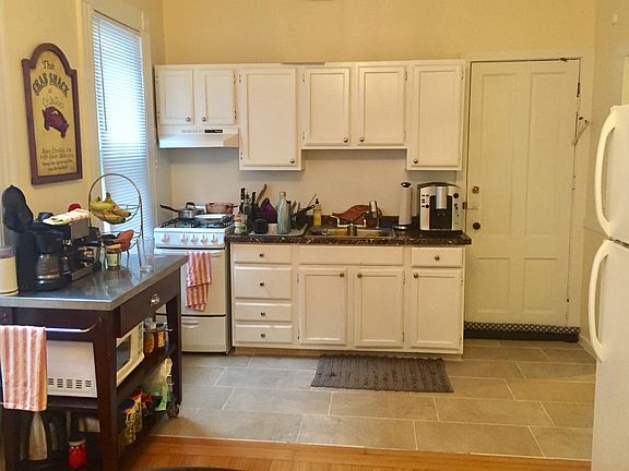 large, sunny, eat in kitchen with gas stove and refrigerator