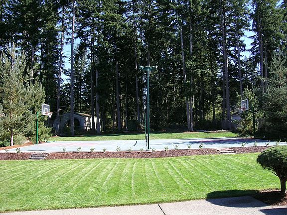 Spacious back yard with lighted Sport Court!!!