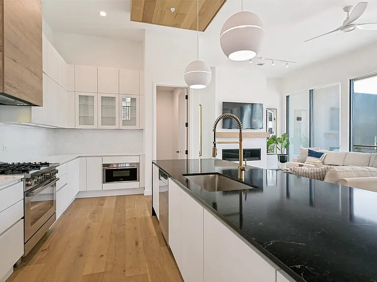 Gourmet kitchen designed for effortless entertaining, featuring upscale finishes, generous storage, and a spacious walk-in pantry.