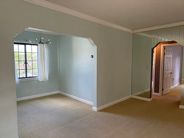 Walking in the front entrance. View of living room and dining room.