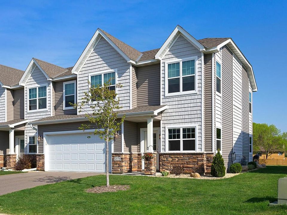 Beautifully maintained end unit includes attached two car insulated and sheetrocked garage.