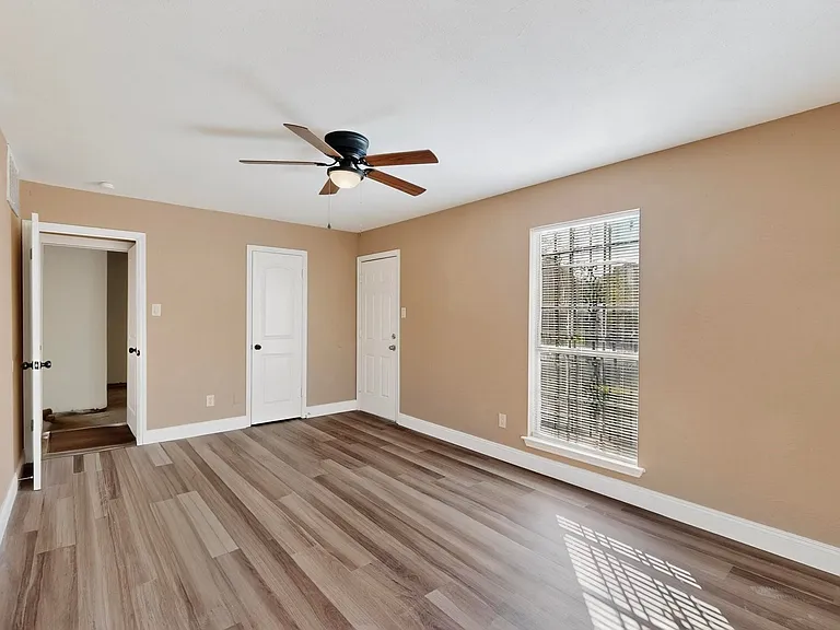 Unfurnished bedroom with light wood-style flooring and ceiling fan