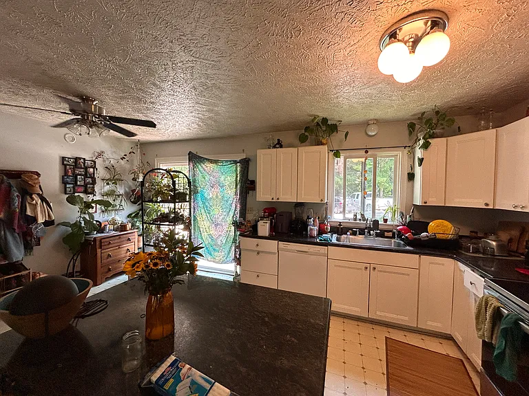 Open concept living area with an island and separate dining space.