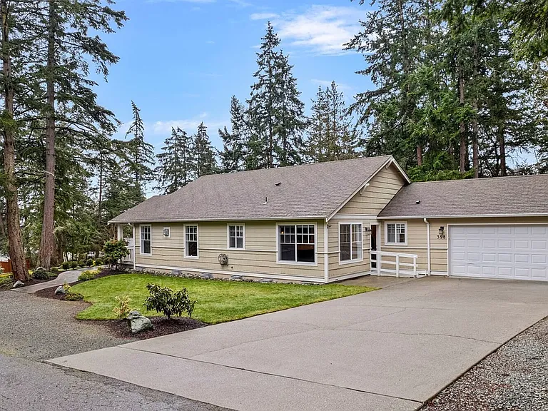 House Side (50ft deep driveway supports 4 cars + 2 cars in gravel/left side) = 6 Cars ON Property Parking Available
