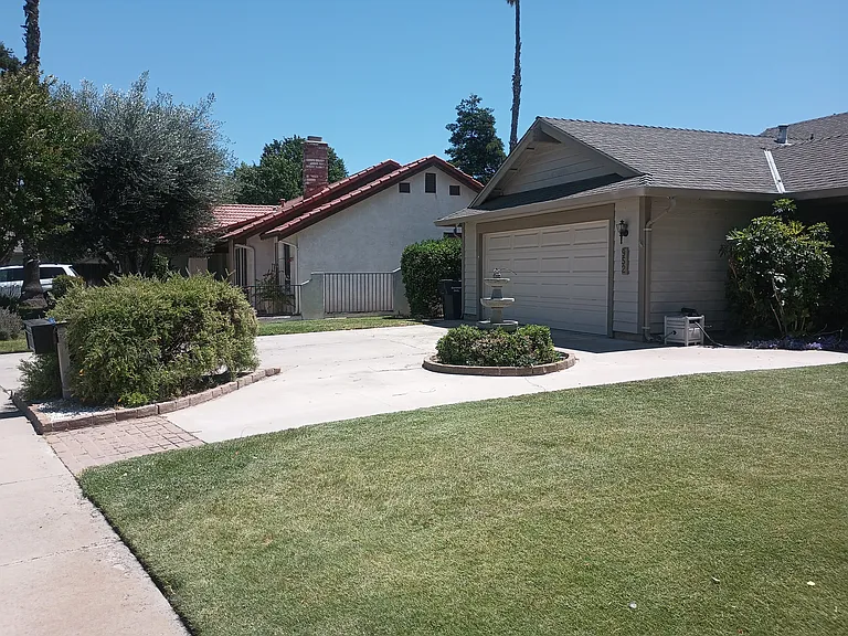 Front of home, 2 car driveway, 2 car garage with garage door opener