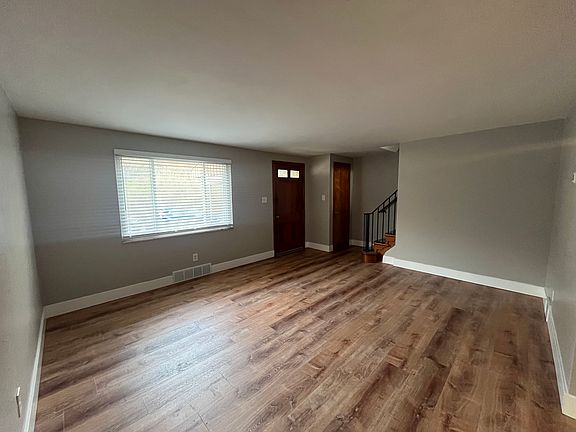 Living Room: New vinyl flooring, coat closet