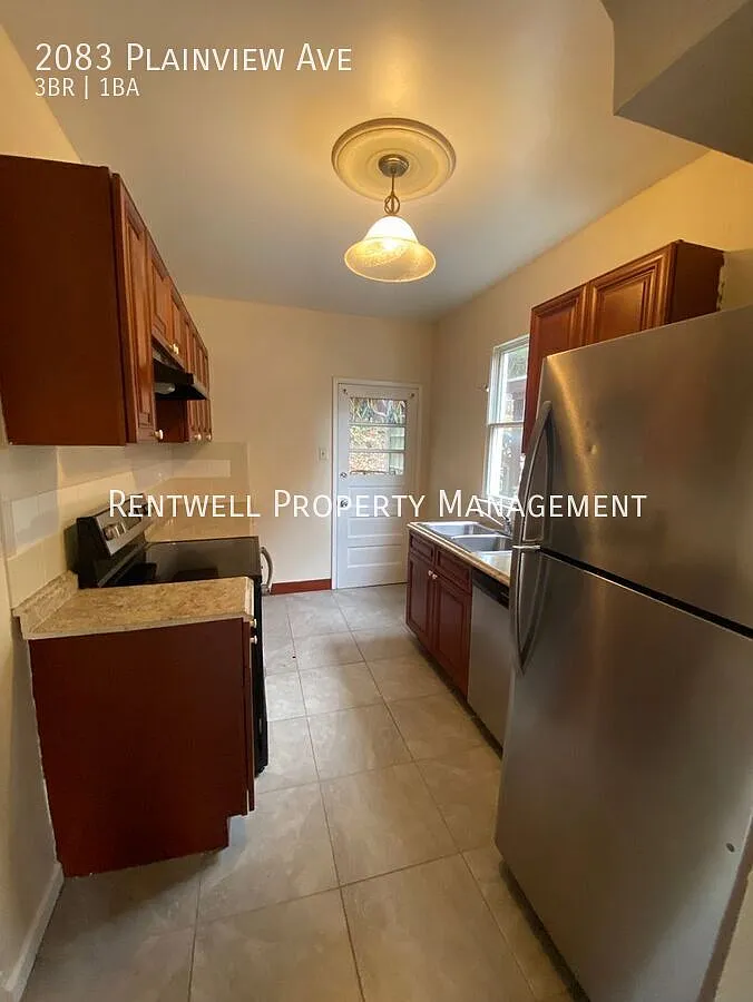 Beautifully Updated 3-Bedroom Home with Exposed Brick Fireplace — Photo 3