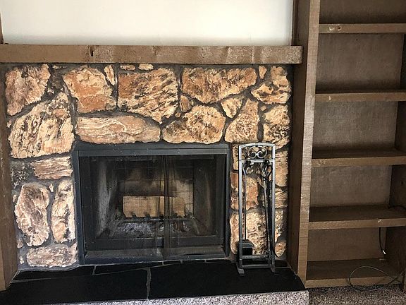 Fire place in the main dinning area plus book cases