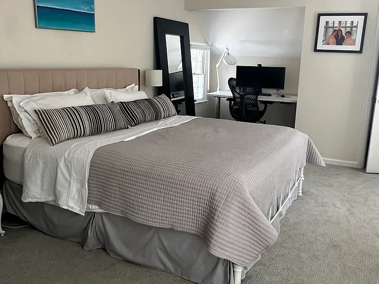 Primary bedroom with office space or reading nook.