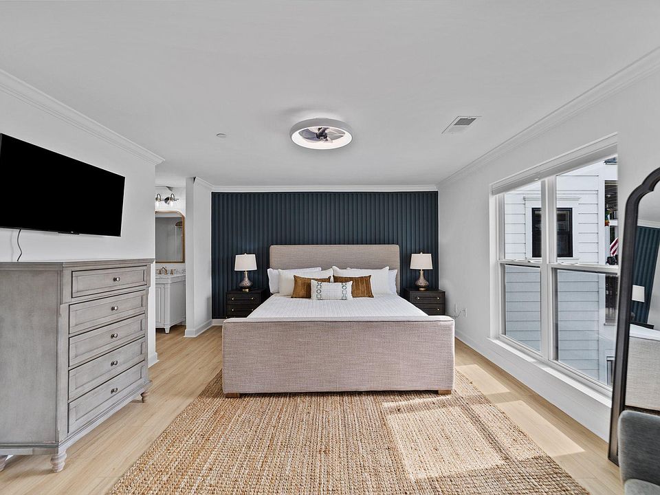 Primary bedroom with king bed and lake views