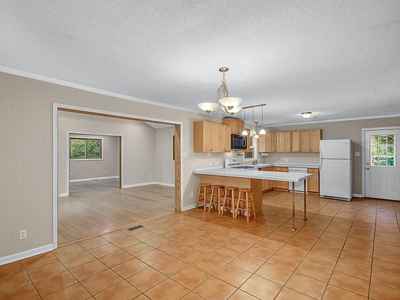 kitchen, dining area, 2 cathedral-ceiling back rooms