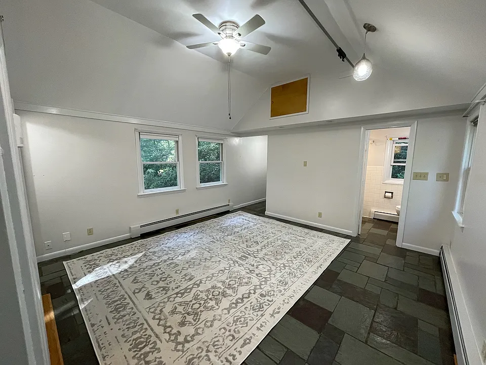 Large living room with vaulted ceiling as you enter the apartment.