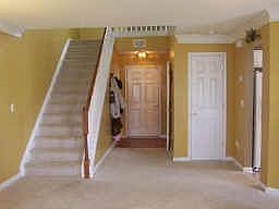 Beautiful entry way, hardwood foyer and 1/2 bath, storage and coat closets!