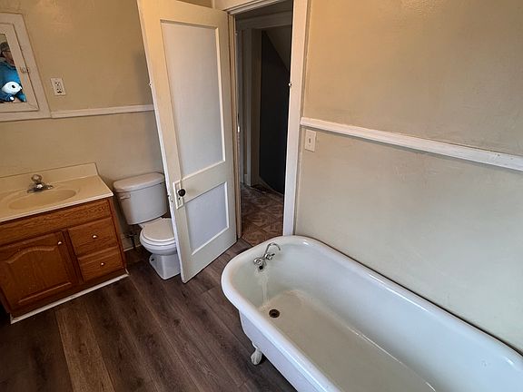 Upstairs bathroom with claw bathtub.
