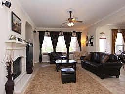 Family Room With Fireplace*Wall Of Windows* Ceiling Fan*Custom Window Coverings*Neutral Colors.
