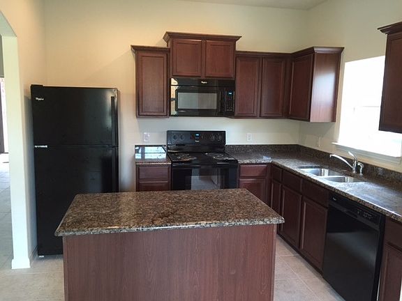 Granite countertop kitchen with appiances