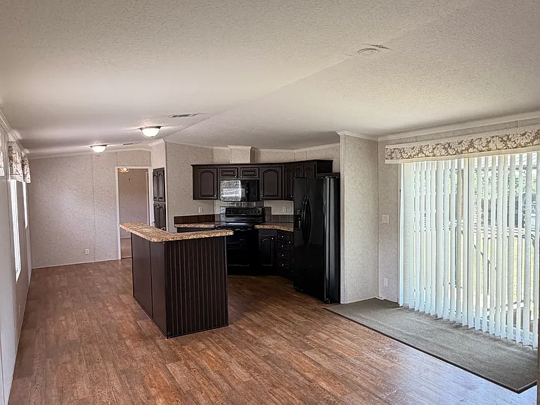 Open concept living room, kitchen, dinning room.