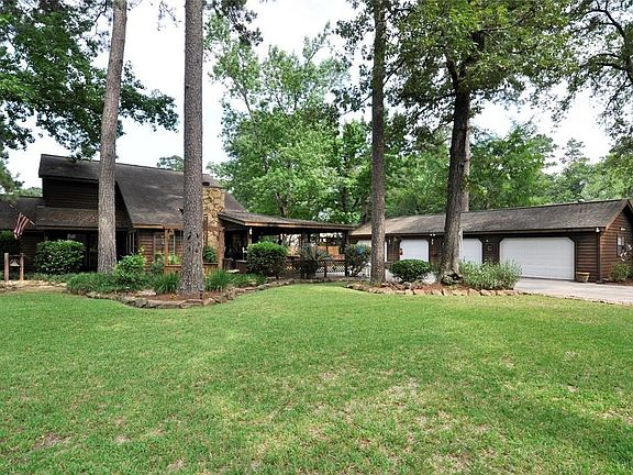 Here is another view of how Lovely and Broad this is featuring the 4+ Car Garage is in the background.  There are Full Sprinklers on this property.