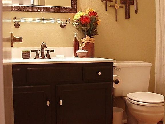 Remodeled bathroom with updated plumbing, fixures, sinktop,designer mirror. 