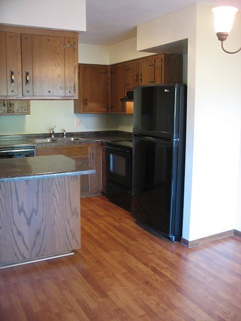 New laminate wood floors in kitchen & dining