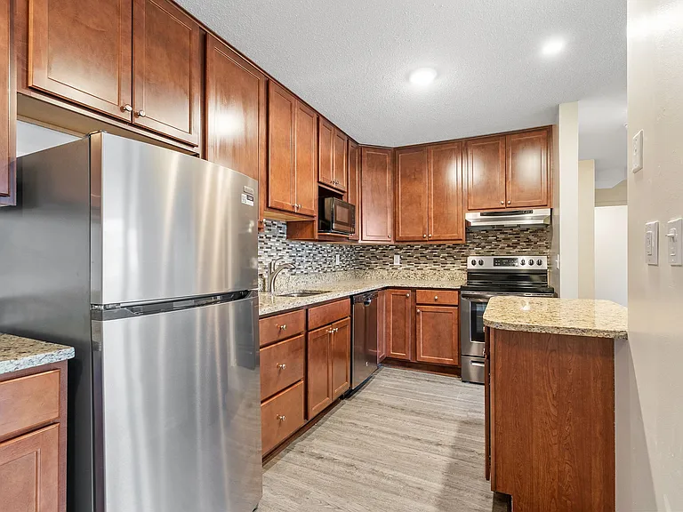 Elevate your lifestyle at Central Lakes of Uptown. This stunning kitchen boasts modern finishes, stainless steel appliances, and ample storage, perfect for culinary enthusiasts. Embrace luxury living todayschedule your visit!
