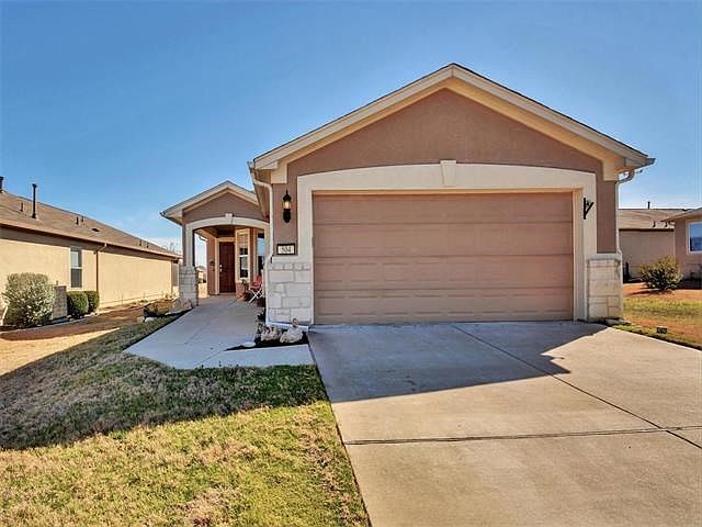 Single story stucco and stone home in Sun City.
