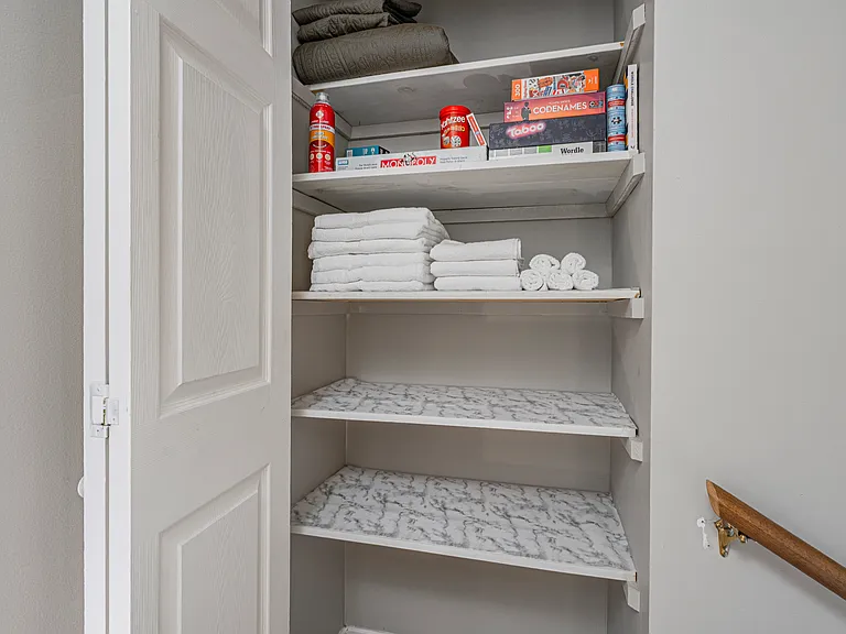 Upstairs hall closet with plenty of storage