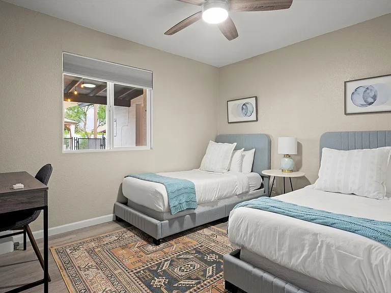 Twin Bedroom 
(can be converted to single King configuration)
Black out shades
Ceiling Fan 
Desk
Closet with dresser for storage