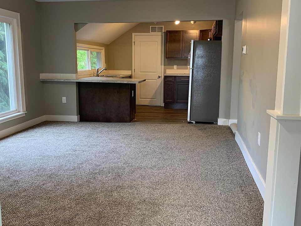 Entrance through living space to open plan kitchen.