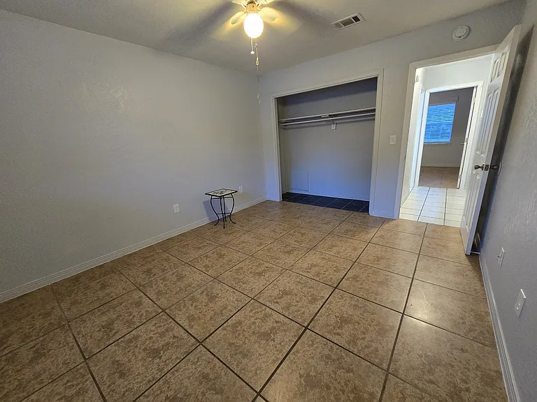 Front bedroom door and closet.