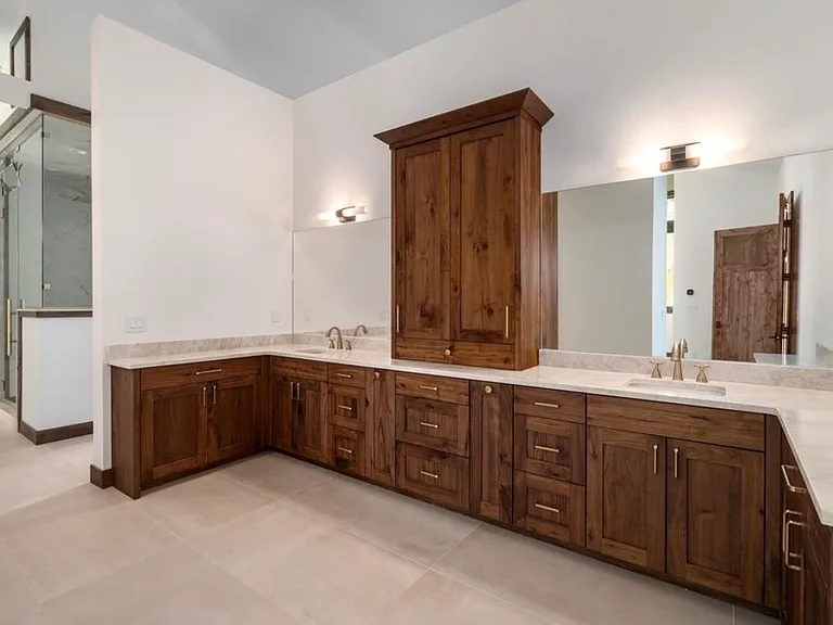 His/Her custom built vanity, 10'x10' double headed shower, steam shower with benches to enjoy after a long day skiing