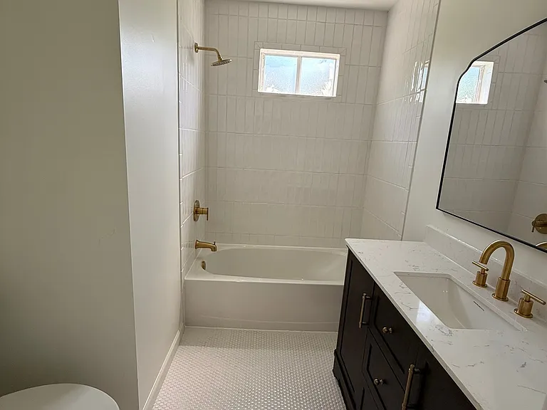 Newly renovated bathroom with marble vanity top.