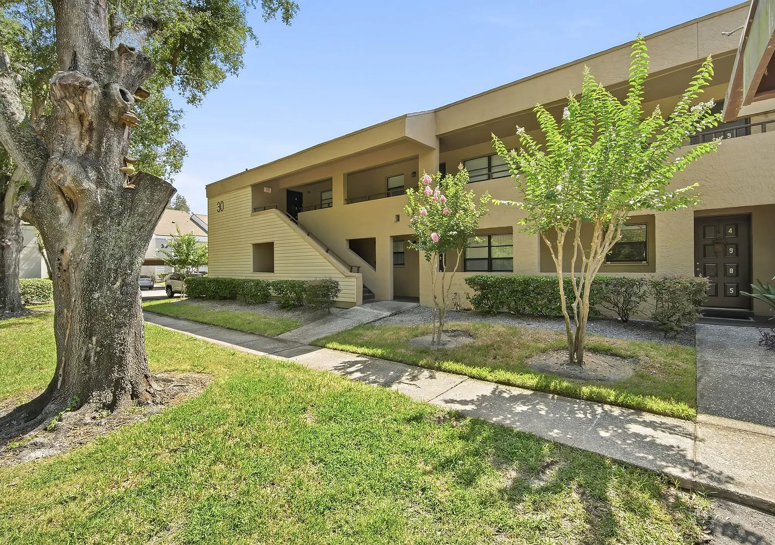 Spacious 2BR / 2BA Condo with Pool View in Guard-Gated River Oaks Community! — Photo 1