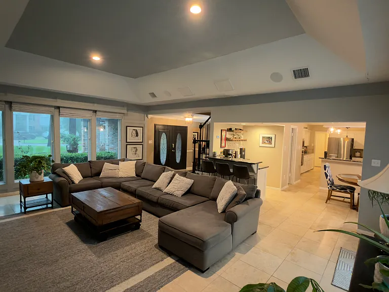 Open area into bar area, breakfast nook and kitchen