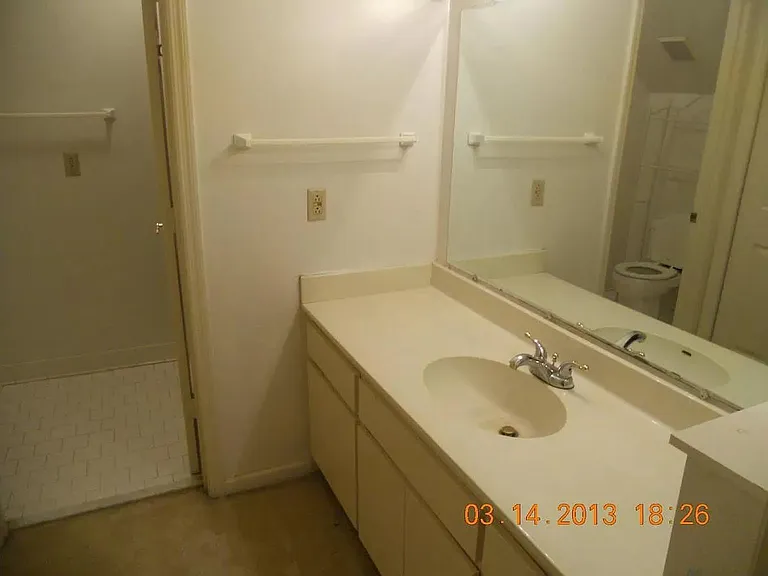 master bedroom with full bath and laundry
