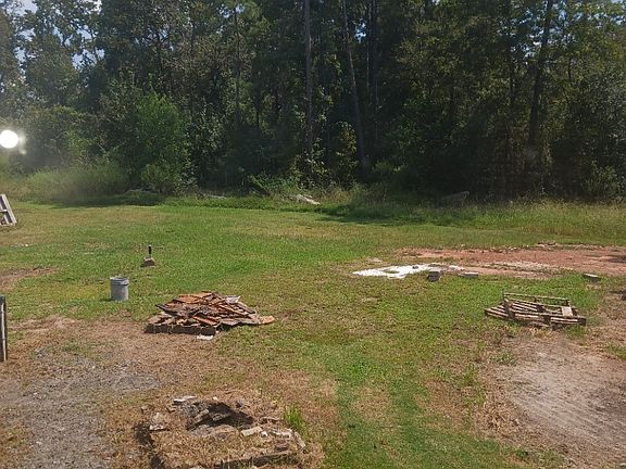 Back yard. We are waiting on a rain so we can burn the wood.