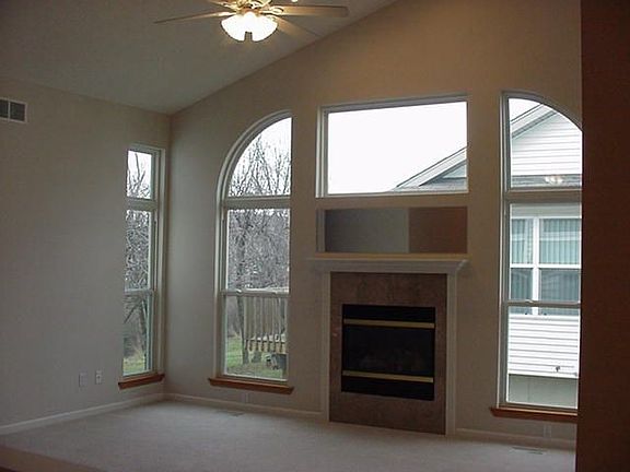 Large living room with fireplace and vaulted ceilings