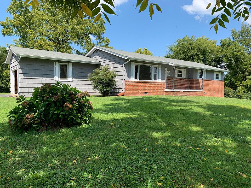 Front of house with large front yard and front porch