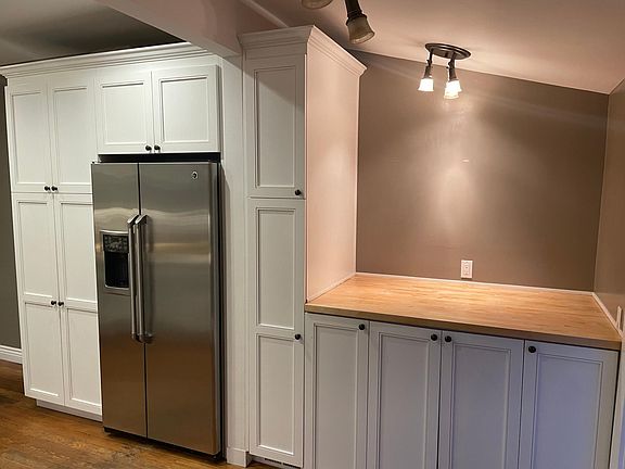 Kitchen with hidden laundry