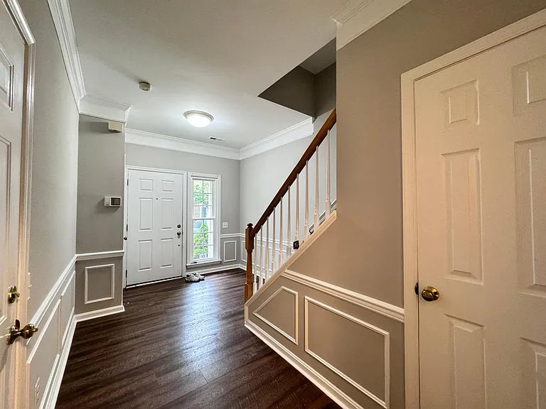 FOYER LEADS TO GARAGE