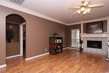 Large Den with gas fireplace, laminate wood floors,crown molding..