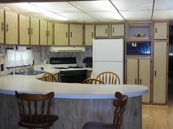 KITCHEN WITH BREAKFAST BAR, ALL APPLIANCES, AND LOTS OF CABINETS