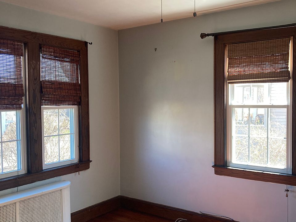 Specious and bright Bedroom #1 with hardwood floors, ceiling fan.