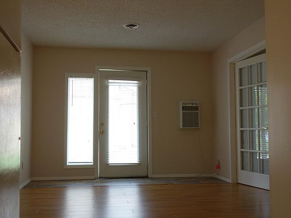 Living room with double doors that open to the master bedroom